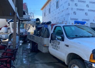 cement truck and work truck on site