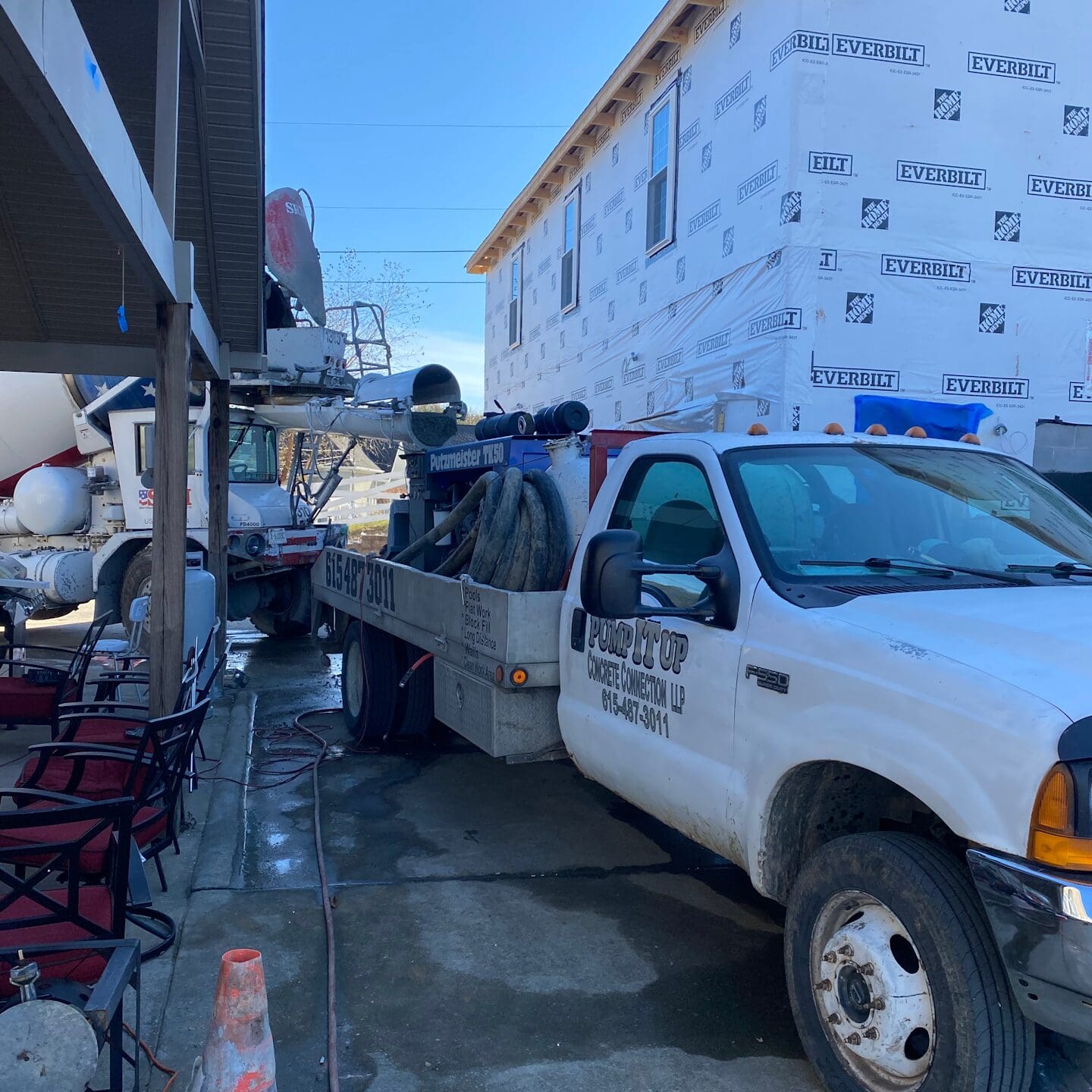 cement truck and work truck on site