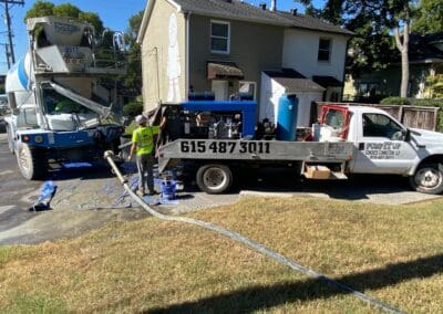 fixing a driveway in front of a house