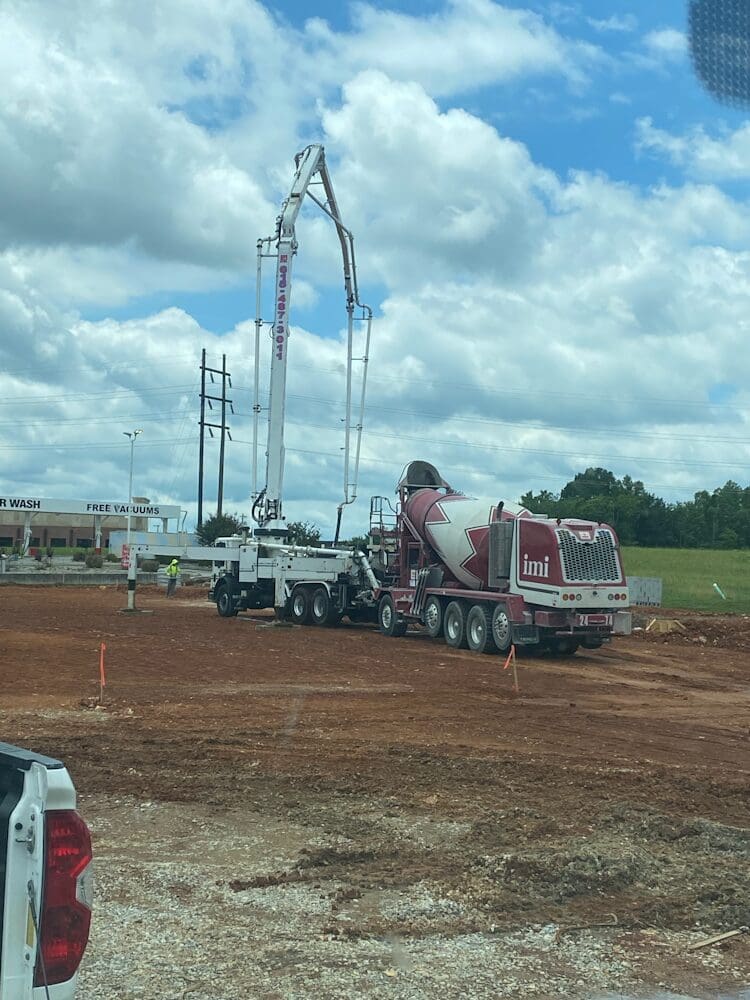 cement truck and work truck on site